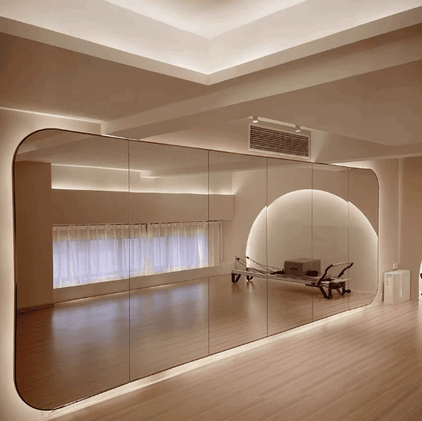 Backlit frameless gym mirror by WOSEN Mirror